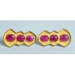 A GOOD PAIR OF CABOCHON RUBY EARRINGS in 18ct gold.