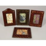 FOUR LEATHER PHOTOGRAPH FRAMES.