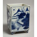 A CHINESE BLUE AND WHITE SQUARE SHAPED BRUSH POT with landscape scenes. 6ins high.