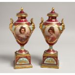 A VERY GOOD PAIR OF 19TH CENTURY VIENNA TWO HANDLED URNS, COVERS AND STANDS painted with