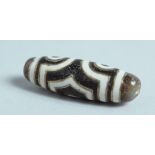 A GOLD INLAID AGATE ZUI BEAD.