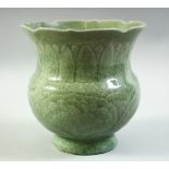 A CHINESE CELADON GLAZE PORCELAIN VASE, with incised decoration under glaze. (af), 18cm high