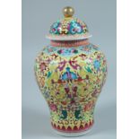 A CHINESE FAMILLE JAUNE CIRCULAR VASE AND COVER 9ins diameter.