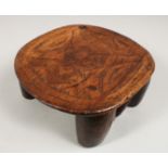 A CARVED AFRICAN STOOL. 8ins long.