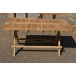 A folding hardwood rectangular garden coffee table