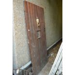 A hardwood external door with frame.