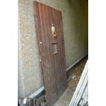 A hardwood external door with frame.