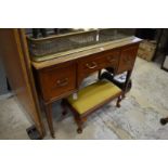 An Edwardian inlaid mahogany writing table.