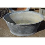 A large galvanised bath tub.