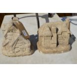Two small garden ornaments modelled as houses.