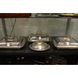 Three rectangular entree dishes and covers together with a small oval entree dish and cover.