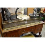 A pierced brass fender.