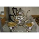 A plated four piece tea and coffee service.