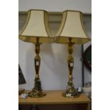 A pair of brass table lamps.