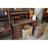 An oak roll top desk.