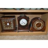 Three mantle clocks.