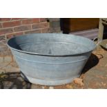 A large galvanised bath tub.