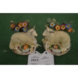 A small pair of Staffordshire models of recumbent sheep (af).