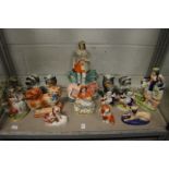 A good collection of Staffordshire figures to include dogs etc.