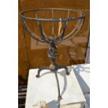 A wrought iron plant stand.
