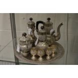 An Eastern white metal four piece coffee service with matching tray and four goblets.