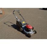 A Honda petrol rotary lawn mower.