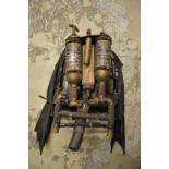 An unusual steam punk movie prop jet pack with folding wings.
