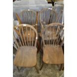 Six stickback kitchen chairs.