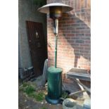 A large floor standing patio gas fired heater.