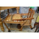 An old fashioned child’s metamorphic highchair.