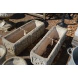 A pair of composite rectangular planters.