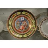 A Vienna dish with decoratively painted central panel.