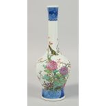 A CHINESE FAMILLE ROSE PORCELAIN BOTTLE VASE, decorated with birds and native flora, 32cm high.