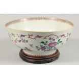 A SAMSON FAMILLE ROSE PORCELAIN PUNCH BOWL, together with a hardwood stand, the exterior painted