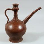 A 17TH CENTURY PERSIAN SAFAVID COPPER EWER, with inscription to the body, 29cm high.