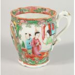 A CHINESE CANTON PORCELAIN TEACUP, 7cm high.