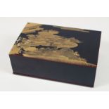 A JAPANESE BLACK LACQUERED LIDDED BOX, the lid with gilt decoration. 16.5cm x 11cm