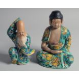 TWO JAPANESE TURQUOISE GLAZE PORCELAIN FIGURES, 18cm and 15cm.