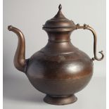 A VERY LARGE 19TH CENTURY INDIAN BULBOUS BRASS EWER, with zoomorphic handle and hinged lid, 42cm