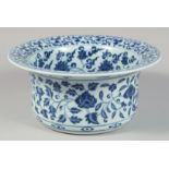 A CHINESE BLUE AND WHITE PORCELAIN WATER BASIN decorated with various flower heads and scrolling