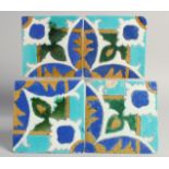 A SET OF FOUR PERSIAN SAFAVID CUERDA SECA GLAZED POTTERY TILES, each approx. 15cm square, (4).