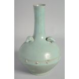 A CHINESE RU STYLE CELADON VASE, with three relief ram's heads to the shoulder, 26.5cm high.