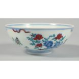 A CHINESE DOUCAI PORCELAIN CHICKEN BOWL, the base with six-character mark. 12cm diamater