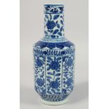 A CHINESE BLUE AND WHITE PORCELAIN VASE, decorated with panels of floral motifs, the base with six-