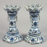 A PAIR OF CHINESE BLUE AND WHITE PORCELAIN PETAL-FORMED CANDLESTICKS, decorated with foliate