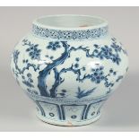 A CHINESE BLUE AND WHITE PORCELAIN JAR decorated with cherry blossom, pine tree, and bamboo. 20cm