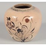 A CHINESE CIZHOU STYLE POTTERY JAR, painted in brown with flora, 17cm high.