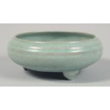 A CHINESE CELADON GLAZE PORCELAIN TRIPOD CENSER with original fitted box. Bowl diameter 17cm