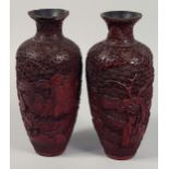 A PAIR OF 19TH CENTURY CHINESE CINNABAR LACQUER VASES, each decorated with figures in an outdoor