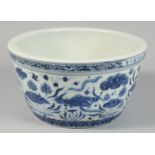 A CHINESE BLUE AND WHITE PORCELAIN BOWL decorated with fish and aquatic flora, the rim bearing six-